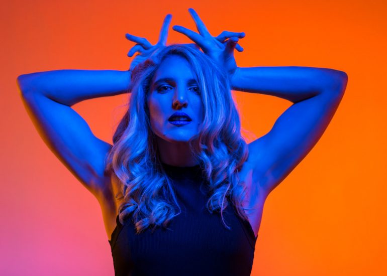 Roxanne-Abbott-Brighton-Musician-by-Music-Photographer-Emma-Bailey-Photography Musician on pink background